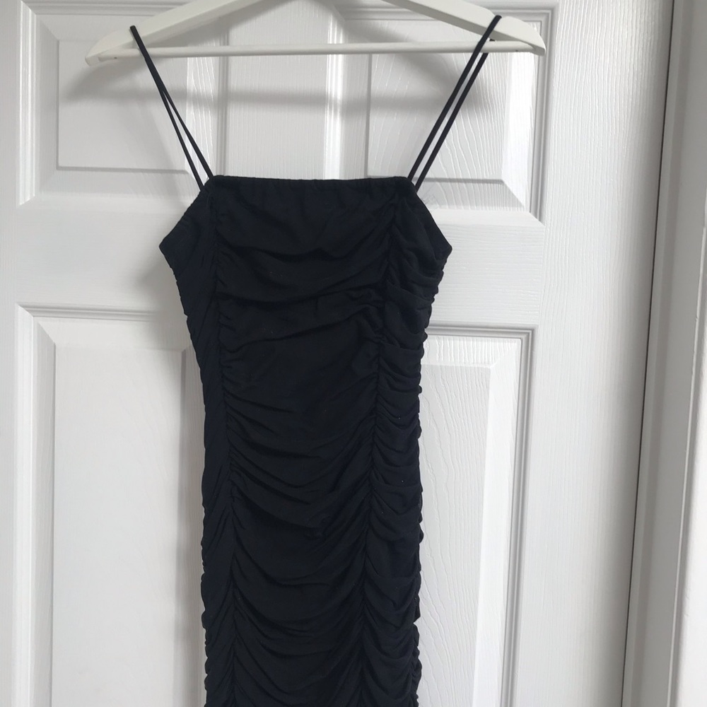 FREE WITH THE BUNDLE
Ruffle Strap Body Cone Mini Dress